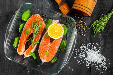 Two raw steak trout with lemon herbs and spices. Top view.