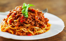 Traditional Pasta Spaghetti Bolognese In White Plate On Wooden Table Background