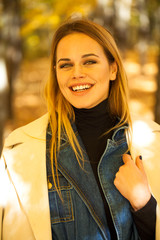 Wall Mural - Portrait of a young beautiful woman in gray coat