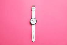 Stylish Wrist Watch On Color Background, Top View. Fashion Accessory
