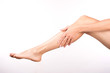 © junky_jess - Female hand with french manicure caress bare leg, isolated on white