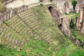 Wall Mural - Aerial view of the old ruins of an ancient Roman amphitheater in Volterra, Italy