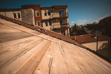 Rooftop reparations,new construction materials and the view from the top of the building.