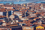 Fototapeta Miasto - Venice panoramic aerial view with red roofs, Veneto, Italy. Aerial view with dense medieval red roofs of Venice, Italy