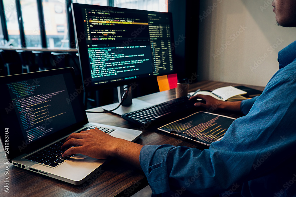 Programmer working in a software development and coding technologies ...