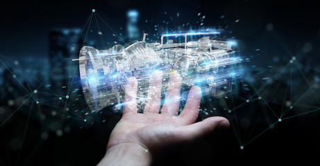 Poster - businessman using wireframe holographic 3d digital projection of an engine