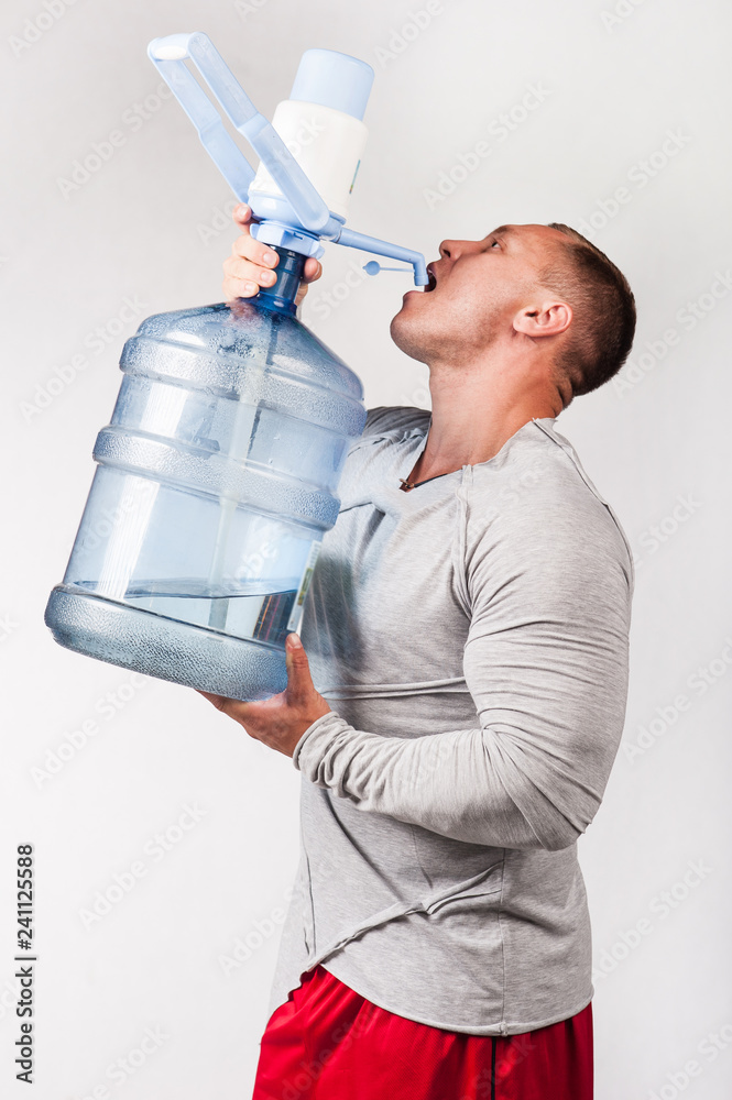 man-drinking-water-from-a-big-bottle-stock-photo-adobe-stock