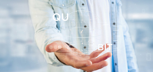 Poster - Businessman holding Quantum computing concept with qubit icon 3d rendering