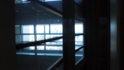 Canvas Print - Inside the glass elevator in building while moving