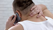 © motortion - Fat man talking on phone and massaging neck, feeling pain, body care, medicine