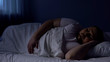 © motortion - Obese man sleeping in bed, relaxing at night on comfortable mattress, rest