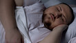 © motortion - Closeup of chubby man sleeping peacefully, relaxing on comfortable mattress