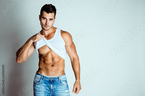 Portrait Of A Handsome Young Man With Stylish Haircut Posing In