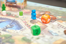 Cubes With The Game On The Table. Themed Board Games. Vertical View Of The Board Game Close-up.