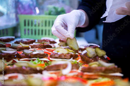 Fotografie, Obraz preparation some delicious small burgers