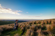 Couple enjoys beautiful bushes  Christchurch city view in New Zealand. Romantic couple goes on dating. A pair of couple goes on honeymoon in natural landscape. Happiness image of a young couple.