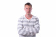 © Ranta Images - Young handsome man with arms crossed isolated against white background