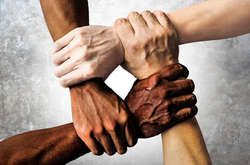 multiracial group with black african american caucasian and asian hands holding each other wrist in 