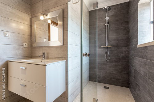 Fotografía Modern bathroom with shower and washbasin for hygiene.