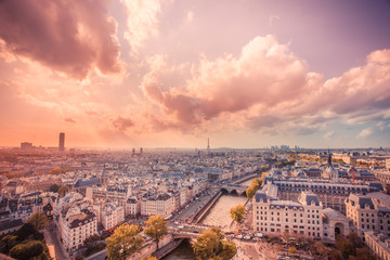 Wall Mural - Sunset over the city of Paris France with rooftops seen from above