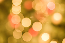 Defocused Christmas Orange Yellow Bokeh White Color Lights Blur City Background In Party Night Light Decoration In Soft For Greeting Card Backdrop With Glitter Sparkle Blurred Circles.