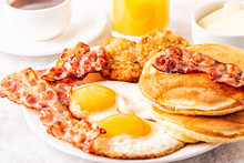 Healthy Full American Breakfast With Eggs Bacon Pancakes And Latkes.