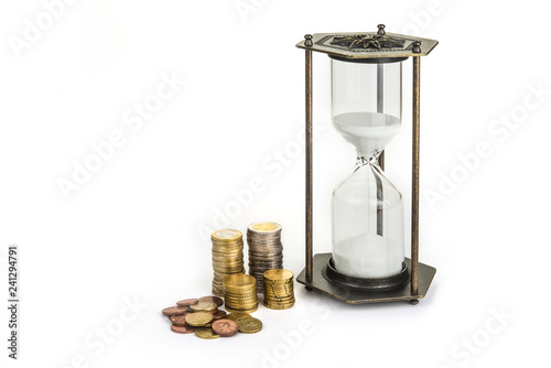 Fotografie, Obraz Hourglass clock with coins. Time is money concept