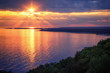 Lake Michigan Coastline Sunset. A scenic view from the Cut River Bridge roadside park overlooking Epoufette Bay in Michigan's Upper Peninsula. Lakeshore background with copy space.