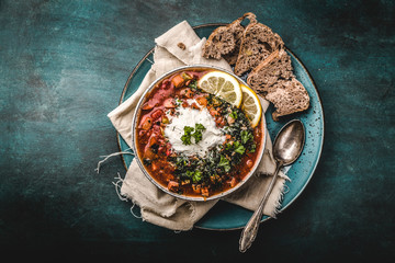 Wall Mural - russian Meat Solyanka Soup In a Bowl with lemon and cream