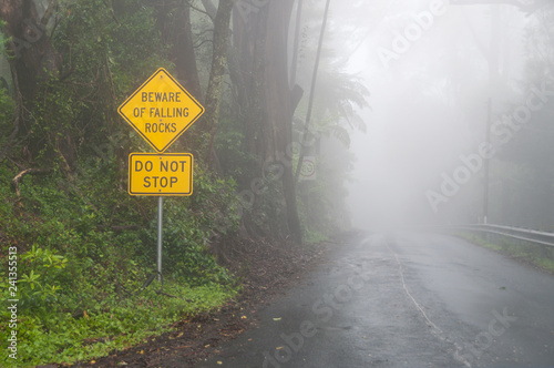 Fotografía Rural road at fog. Dangerous driving conditions metaphor