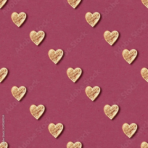 Golden hearts seamless pattern. Gold glitter on red background