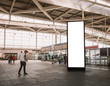 © VTT Studio - Mock up Vertical Banner Billboard stand Media advertising at Train station with Traveling people