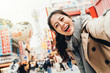 © PR Image Factory - traveler cheerfully taking selfie in tsutenkaku
