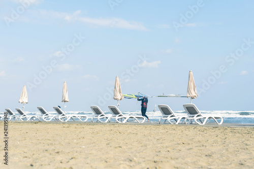 Fotografie, Obraz Windsurfer with board on the Cyprus beach