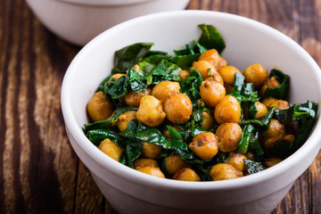 Wall Mural - Spinach with chickpeas salad bowl