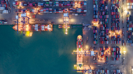 Canvas Print - Container ship in export and import business logistics and transportation. Cargo and container box shipping to harbor by crane. Water transport International. Aerial view and top view.