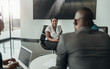 © JonoErasmus - Confident beautiful african bsuiness woman talking to fellow colleagues during a work meeting