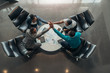 © JonoErasmus - Friendly successful all african business team give high five together in office, excited happy employees celebrating corporate victory, african workers teambuilding concept