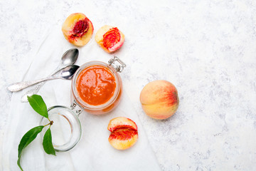 Wall Mural - Homemade peach jam with organic fruit. Sweet preserves on a light background, , copy space