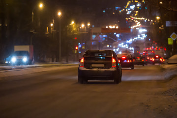 Wall Mural -  car traffic on a night winter street