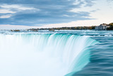 Fototapeta Łazienka - The view across the Horseshoe Falls at dusk, a part of the Niagara Falls, viewed from the Canadian side.  The falls straddle the border between America and Canada.