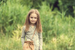 cute little girl is walking in summer
