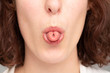 © Alessandro Grandini - Closeup of a beautiful brunette woman rolling her tongue