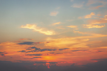 Wall Mural - Beautiful sunset. Orange sky with gray clouds