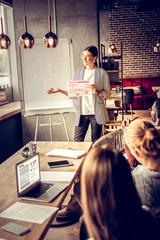 Charming brunette girl presenting her business plan