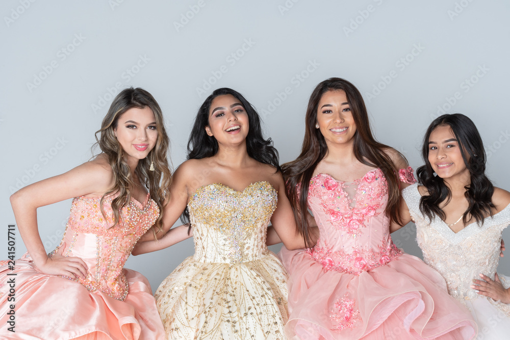 Four Hispanic Girls In Quinceanera Dresses - obrazy, fototapety, plakaty 