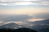 Fototapeta Do pokoju - Distant hills and mountains above a sea of fog and mist, the mist in winter Landscape, view from top of mountain at Doi Phu Co, Mae Hong Sorn, Thailand 
