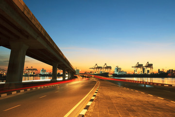 Wall Mural - road ,land bridge run into ship port and commercial cargo plane flying above use for land ,air and vessel transport industry business