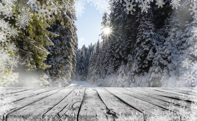 Wall Mural - a wooden table and winter snow landscape with snowflakes