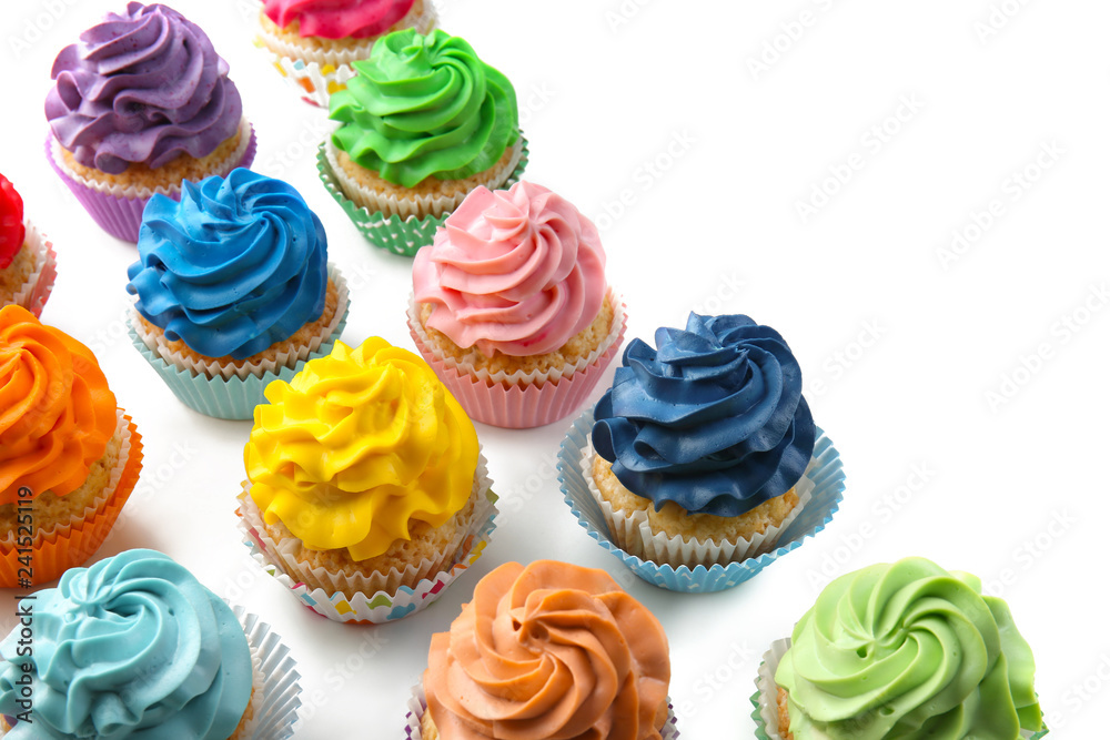 Colorful cupcakes on white background